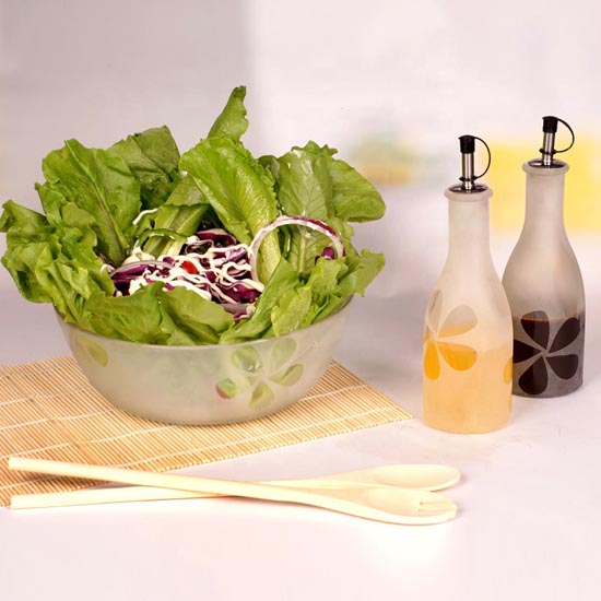frosted round glass bowl and oil bottle